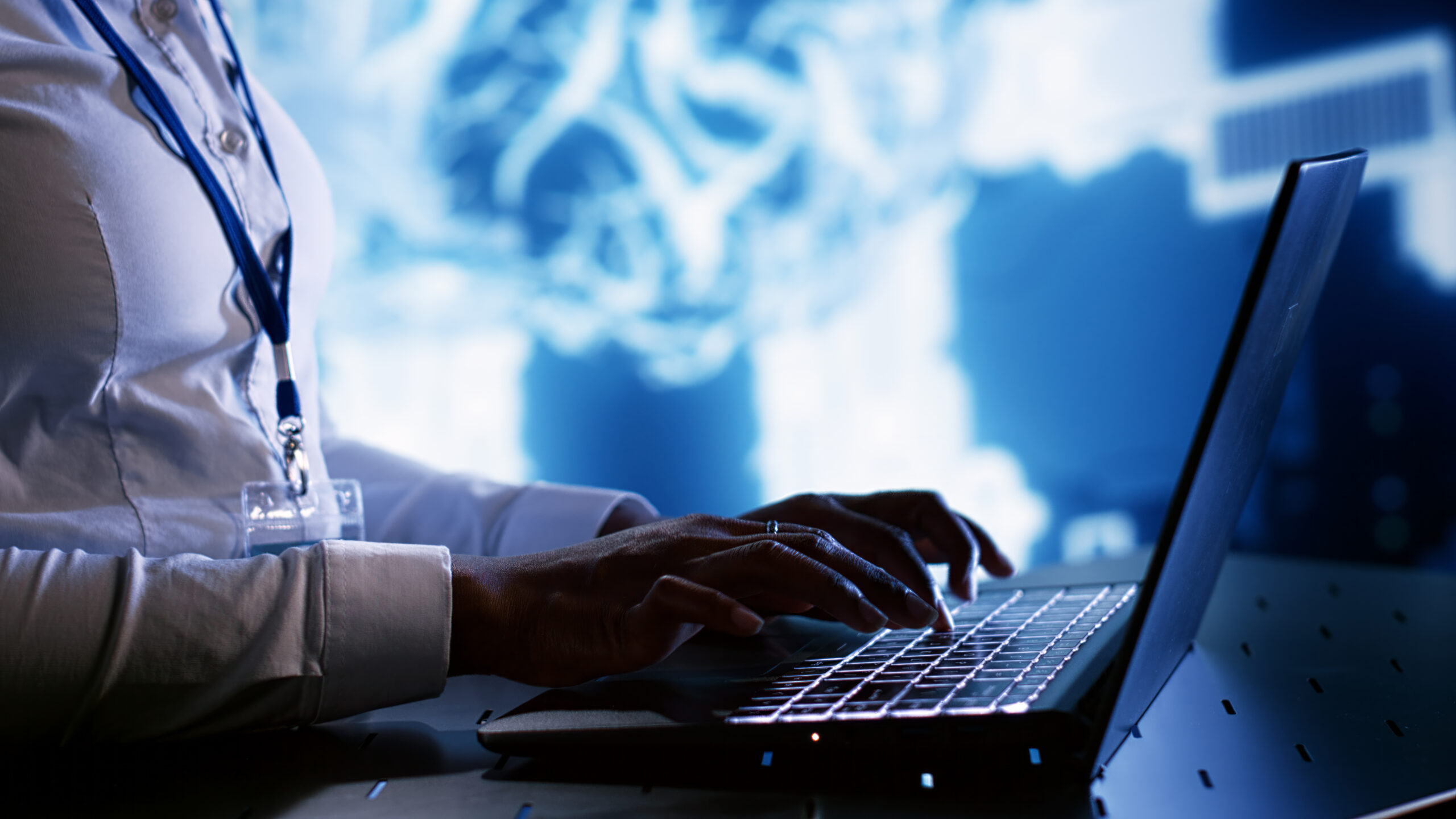 TEch savvy expert writing AI script Admin writing artificial intelligence script code in cloud computing business establishment on laptop terminal. Tech savvy expert doing maintenance work in data center, upgrading AI systems